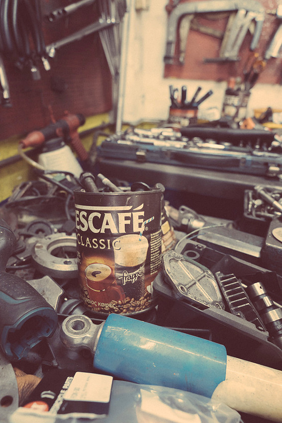 "bike shop", Pireas, "reluctant model", colours,  "nescafé cans", tools, "motor bikes"